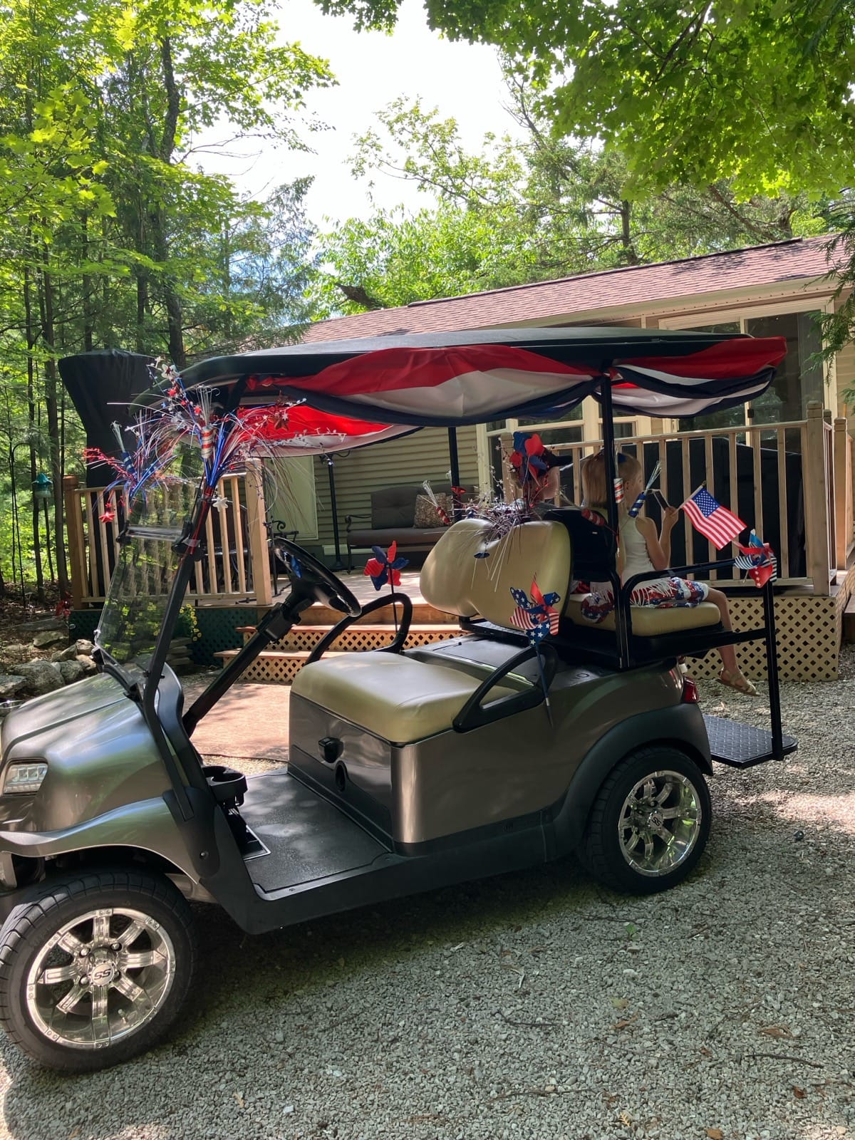 A golf cart decorated for the 4th of July parade
